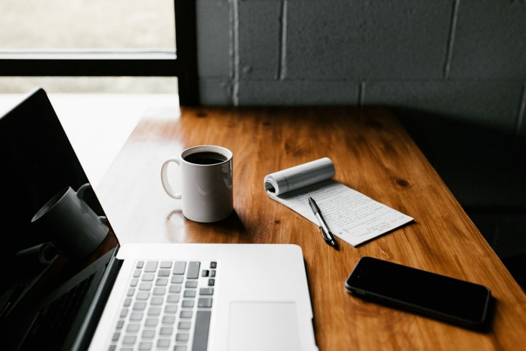 A laptop on a quiet desk, ready for an online therapy session
